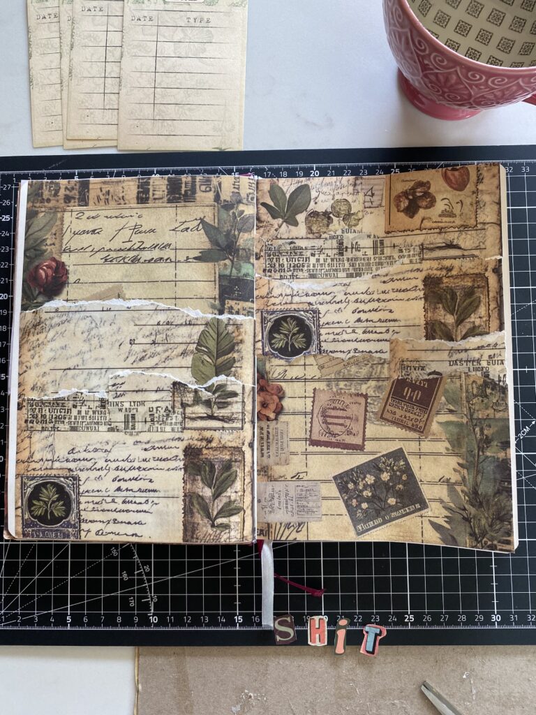 vintage paper torn and stuck into A5 junk journal pages