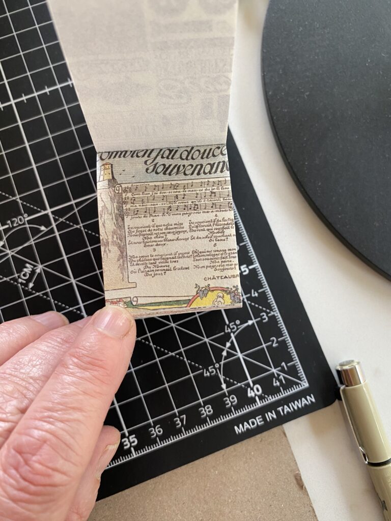 Choosing small papers to go inside a Life Junk Journal