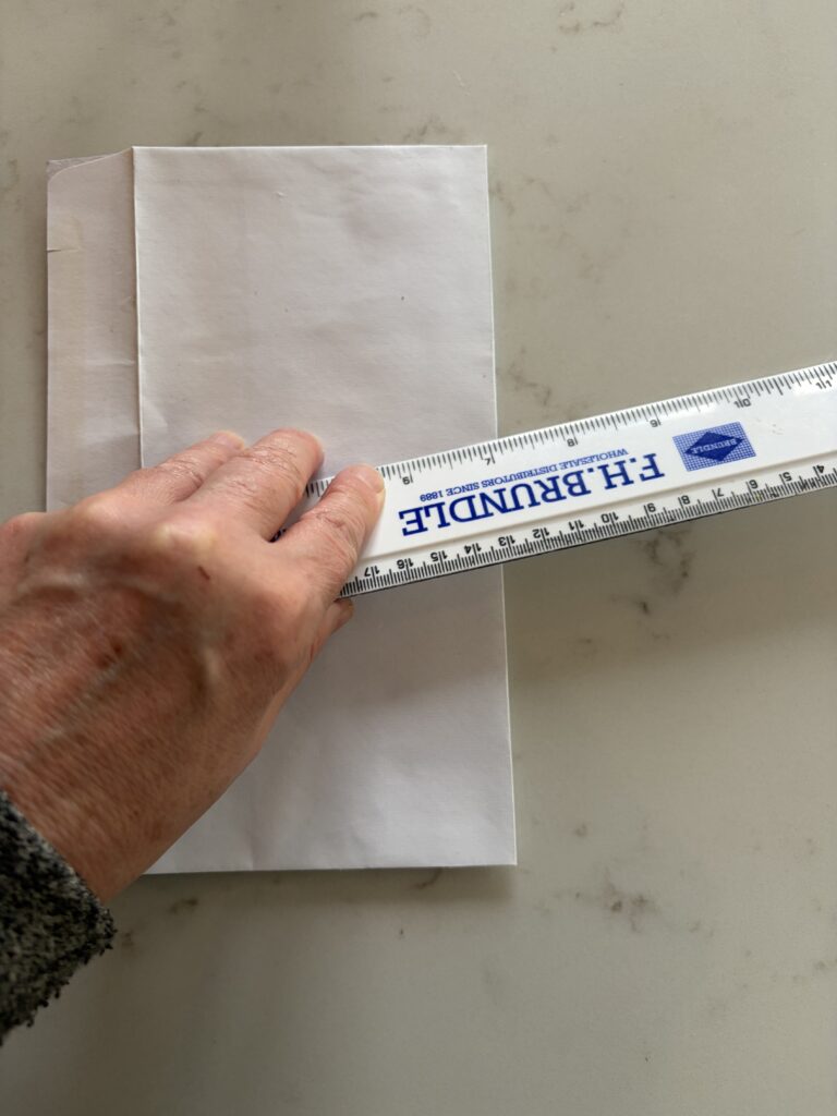 Scoring an old envelope with a ruler
