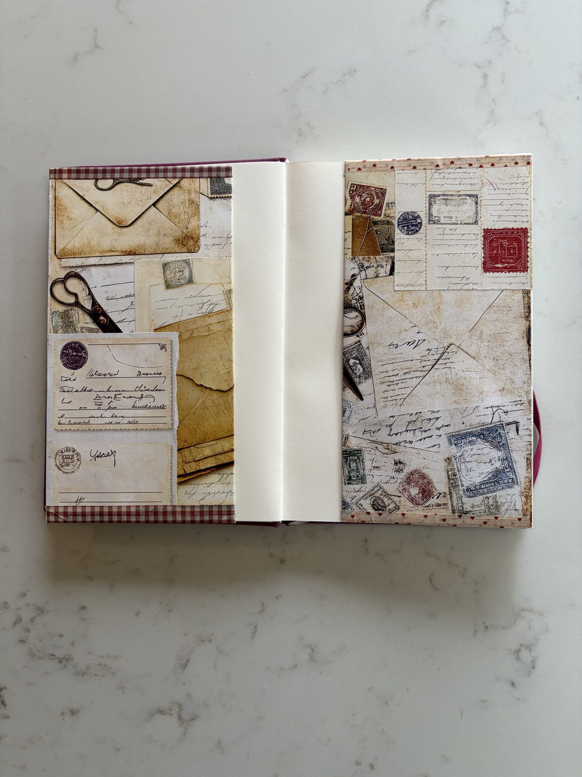 Two envelopes glued in pages of a junk journal